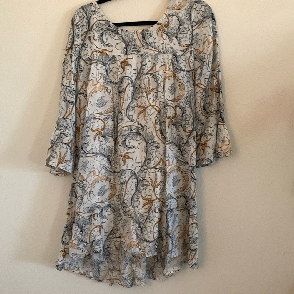 Tunic style dress. Navy gold and cream print.